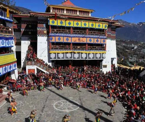 Monastery courtyard filled with pilgrims during a festival gathering